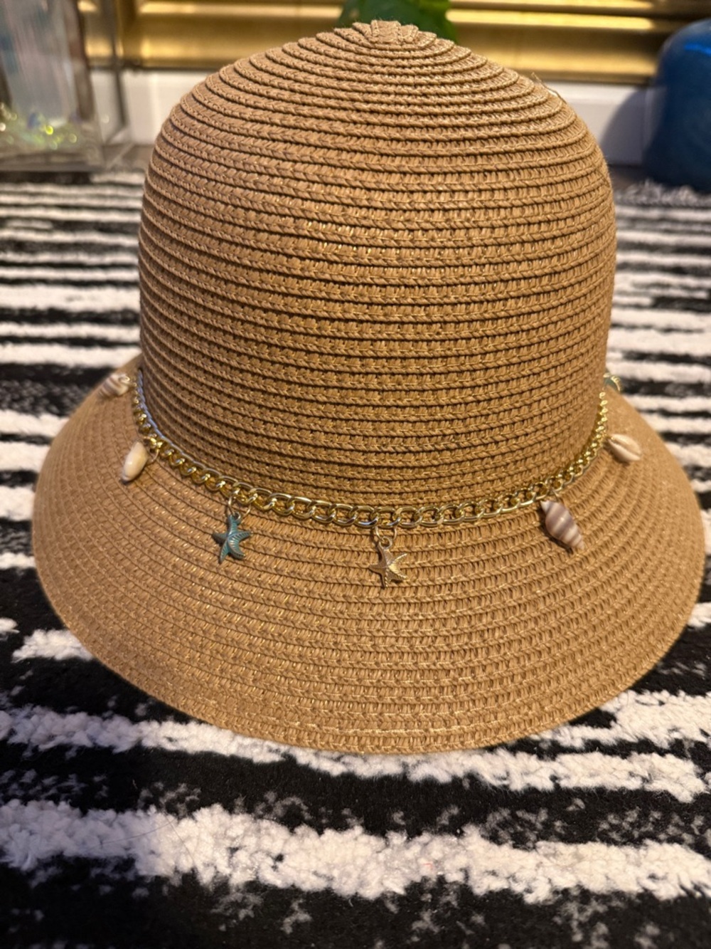 Women’s Tan Straw Cloche Hat with Gold Charm Chain and Shell Accents